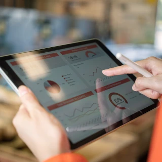 picture of a person checking an analytics dashboard on a tablet
